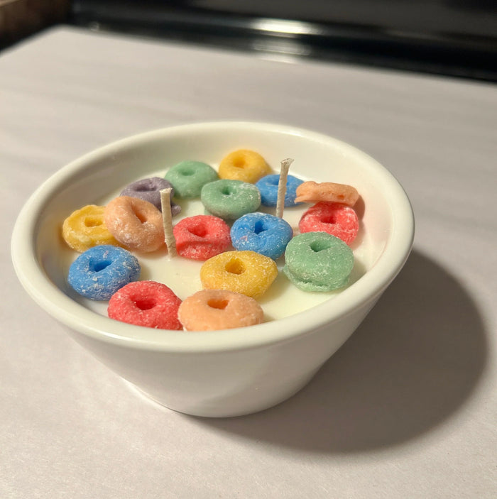 DIY candle shaped like a cereal bowl with colorful fruit loop wax pieces