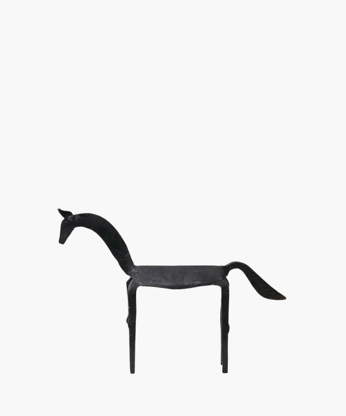 Weathered equestrian sculpture in iron finish styled on a white background. | SW Home