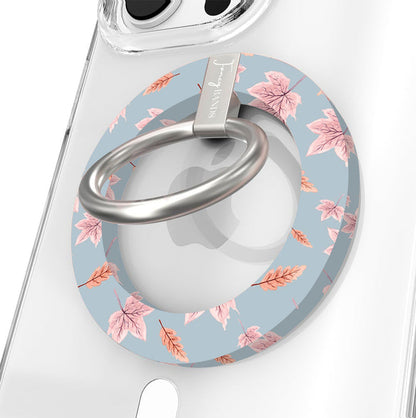 Autumn Breeze Hold It Fancy MagSafe grip ring close-up on a clear iPhone case, showing the slate blue ring with blush maple leaves and wheat sprigs around the silver rotating ring.