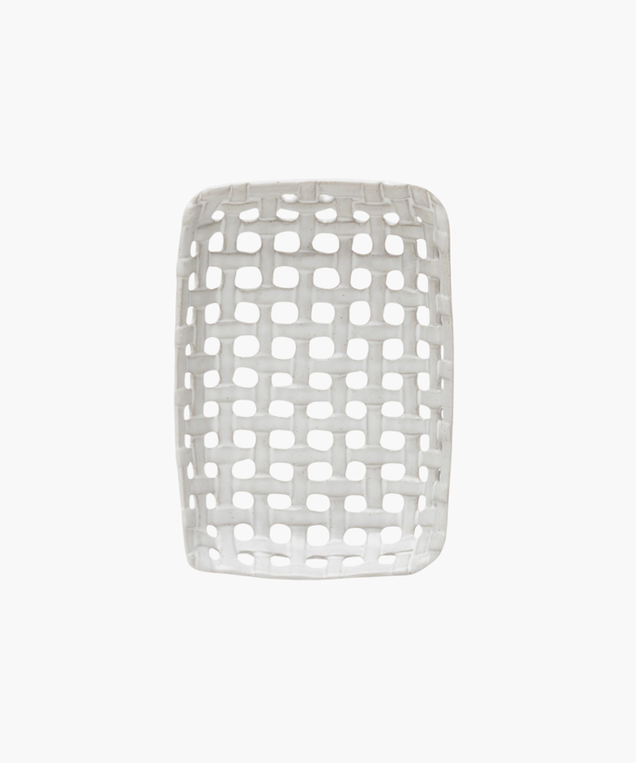 An overhead view of a white, rectangular ceramic basket dish with an open lattice design. The dish has a smooth finish and a contemporary look, evoking a minimalist style. | SW Home