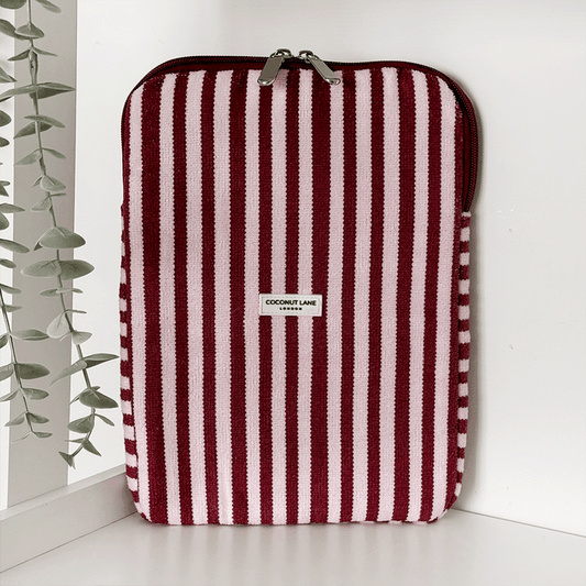Burgundy and light pink striped iPad Sleeve, with silver zip and Coconut Lane logo badge.