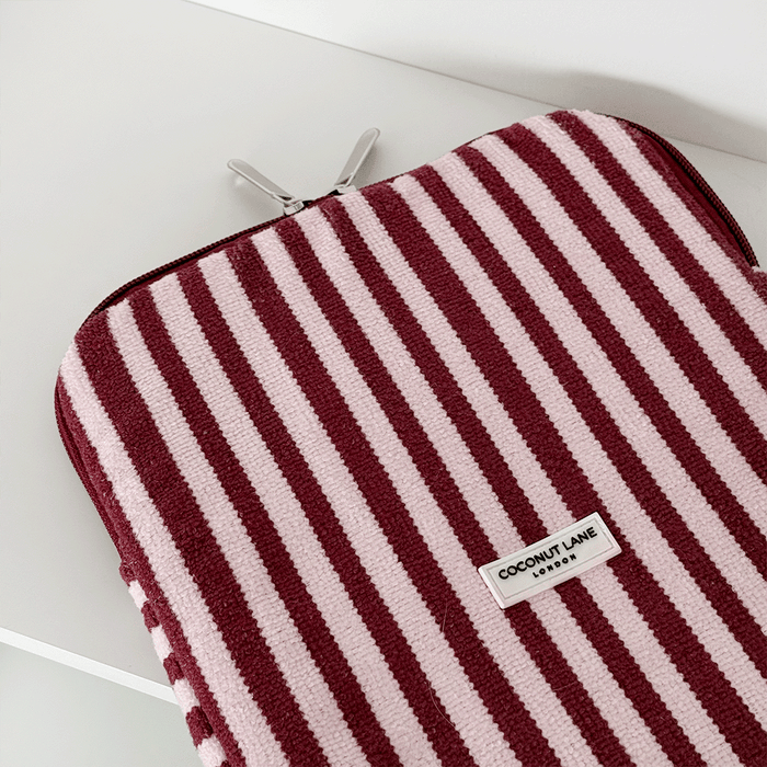 Burgundy and light pink striped iPad Sleeve, with silver zip and Coconut Lane logo badge.