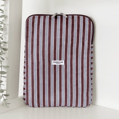 Brown, white and blue striped iPad Sleeve with silver zip and Coconut Lane logo badge.