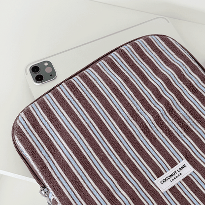 Brown, white and blue striped iPad Sleeve with silver zip and Coconut Lane logo badge.