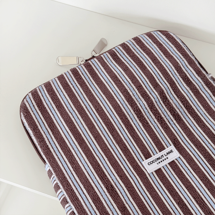 Brown, white and blue striped iPad Sleeve with silver zip and Coconut Lane logo badge.