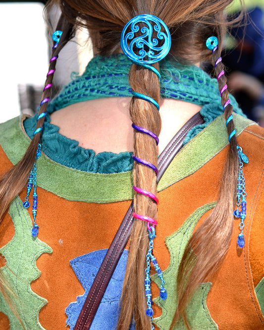 Celtic Rainbow ponytail holder complete set with 6-inch spiral ponytail wrap and matching 4-inch Hair Twisters, featuring a blue Celtic knot design and colorful metal spirals, worn by model from the back.