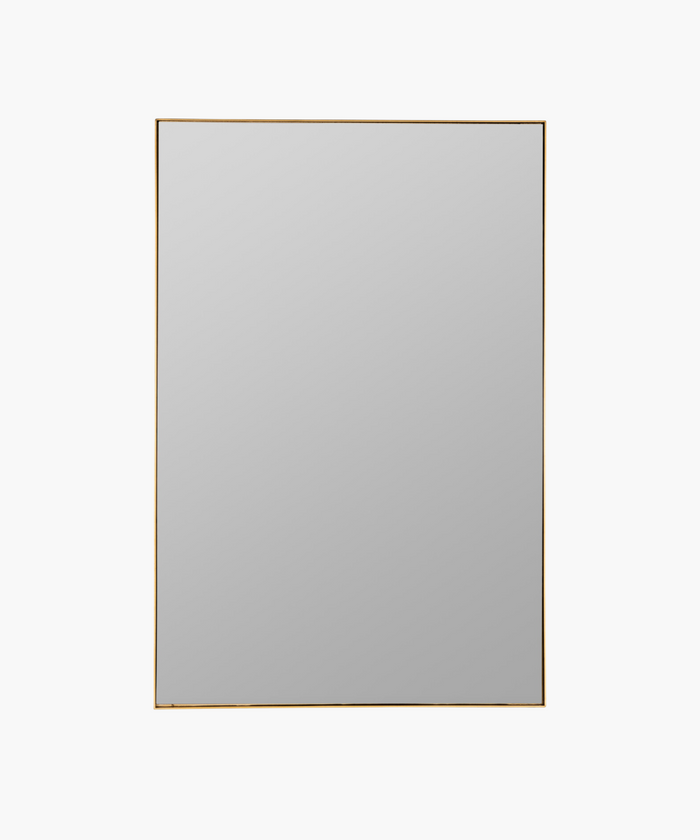 A rectangular gold-framed wall mirror with a plain surface. | Wildwood Home Co.