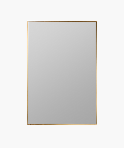 A rectangular gold-framed wall mirror with a plain surface. | Wildwood Home Co.