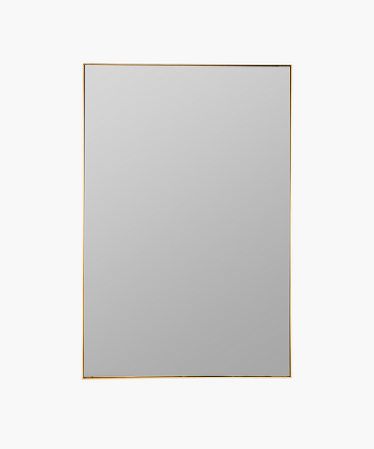 A rectangular gold-framed wall mirror with a plain surface. | Wildwood Home Co.