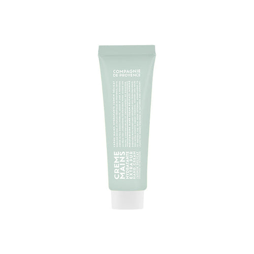 A tube of Compagnie de Provence hand cream with a soft jasmine fragrance, predominantly green in color with product details in white text.