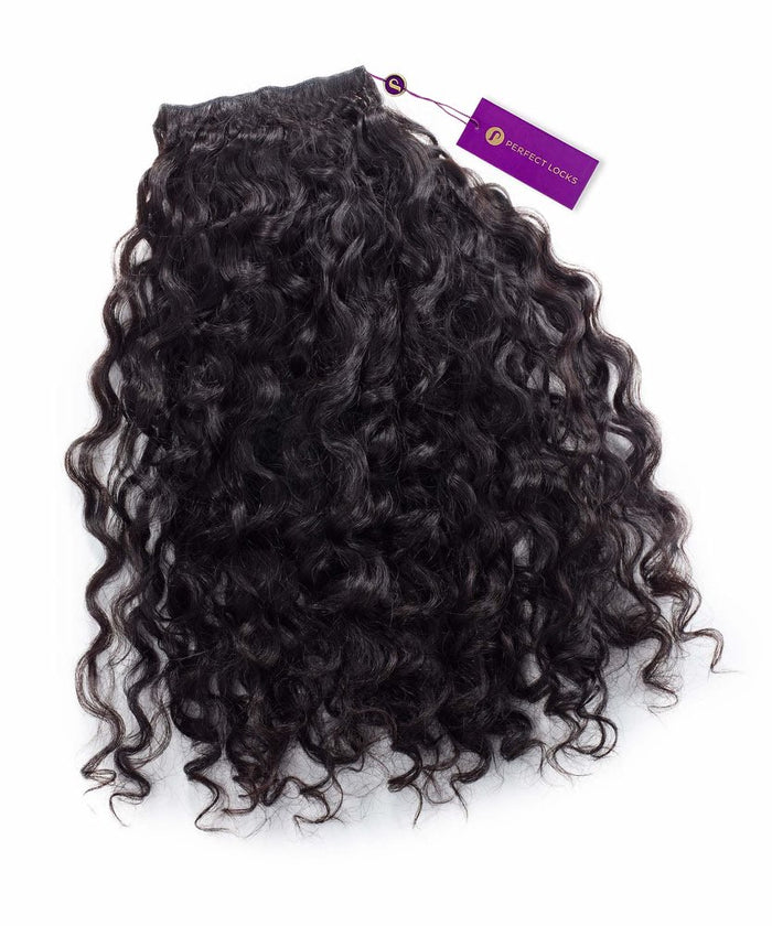 A Curly Virgin Machine Weft hair extension by Perfect Locks in Natural Black , with a purple tag, on a white background.