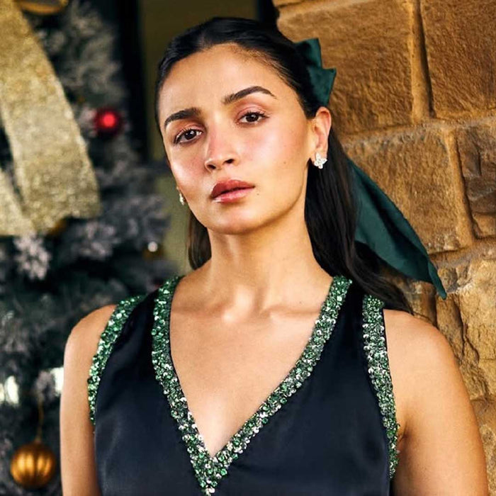 Elegant dark green hair bow with a sparkling center, made for special occasions and glam styling