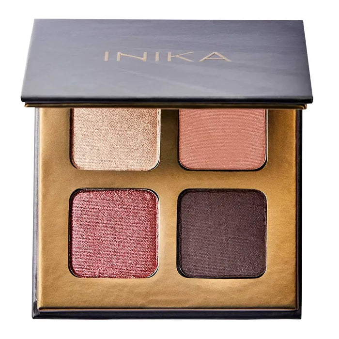 INIKA eyeshadow palette with four colours on a white background. Pink shimmer, gold shimmer, dark brown satin finish, peach satin finish.
