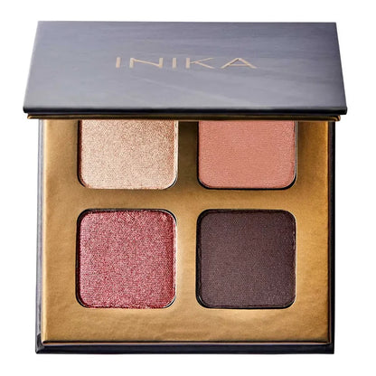 INIKA eyeshadow palette with four colours on a white background. Pink shimmer, gold shimmer, dark brown satin finish, peach satin finish.