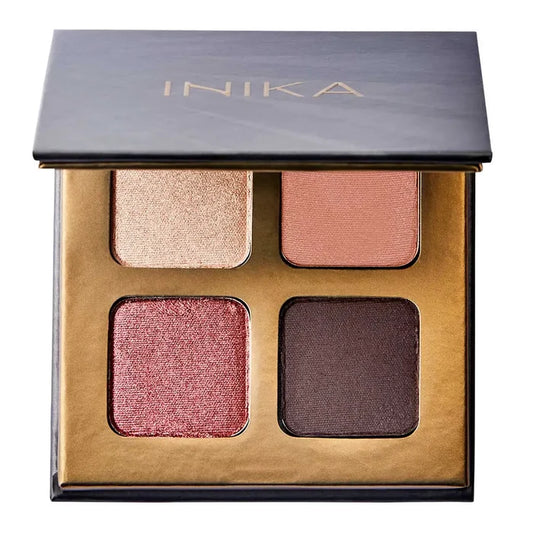 INIKA eyeshadow palette with four colours on a white background. Pink shimmer, gold shimmer, dark brown satin finish, peach satin finish.