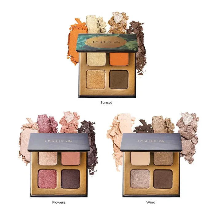 Three INIKA eyeshadow palettes with different colour schemes on a white background.