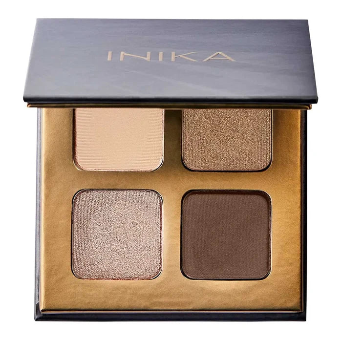 INIKA eyeshadow palette with four shades on a white background. Gold & bronze shimmers, warm dark brown & pale nude satin finishes.