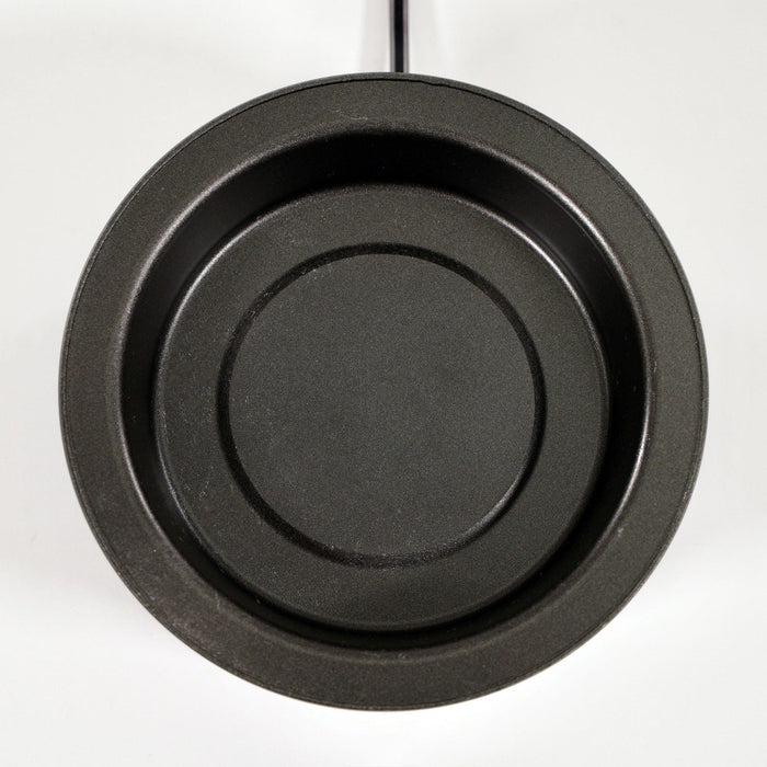 Top view of a round, black, nonstick frying pan with a smooth surface and outward handle on a plain white background.