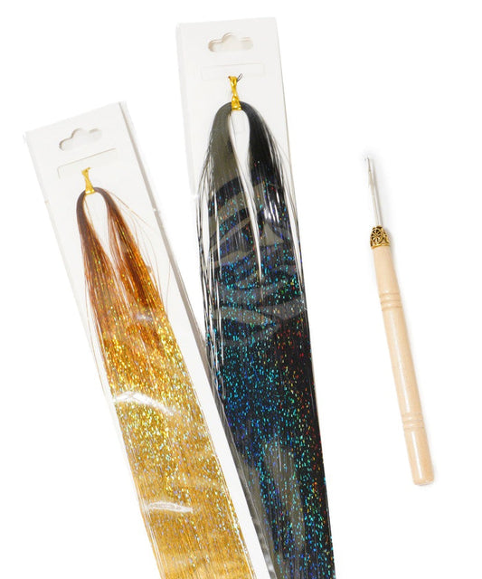 Two packs of glittery hair tinsel, gold and dark blue, with a wooden crochet hook tool on a white background for sparkling hairstyles.
