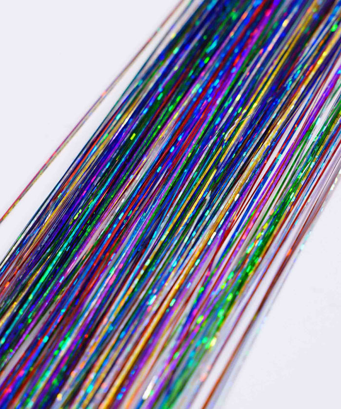 Close-up of Perfect Locks’ Perfect Hair Tinsel in Royal Purple, with shiny strands on white for a vibrant, festive, playful look.#color_rainbow