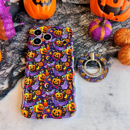 Jack-O-Lantern Jive MagSafe grip ring lying beside the matching Wavy Luxe case on marble, showing the violet neon pumpkin print on both.