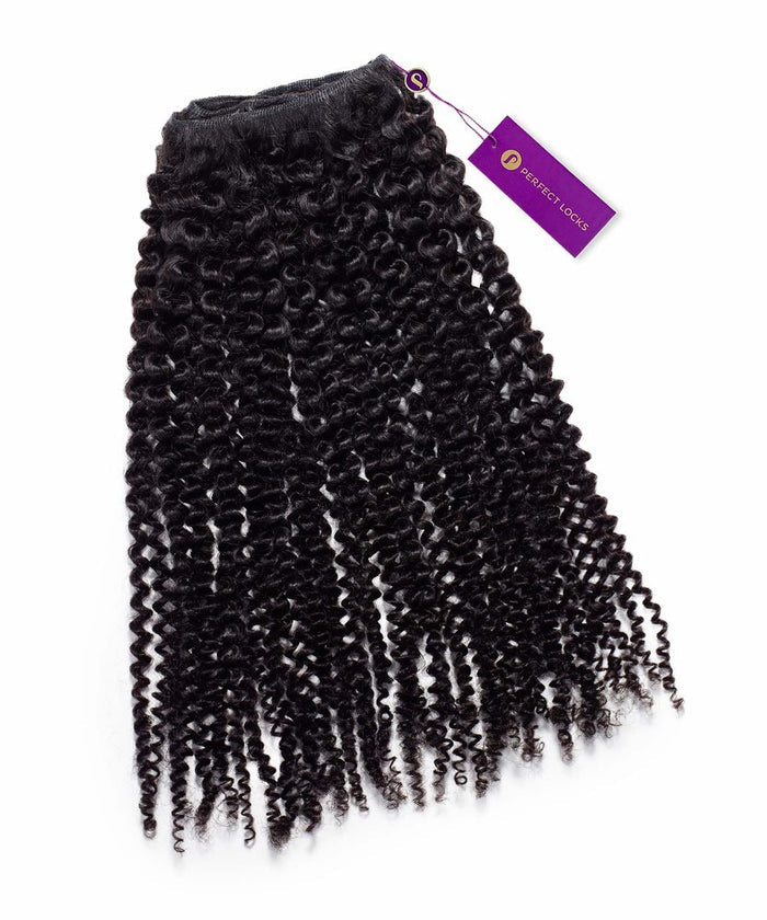 A bundle of Perfect Locks Kinky Curly Steam Permed Machine Weft hair extensions in Natural Black , tightly coiled with a purple tag, displayed on a white background.
