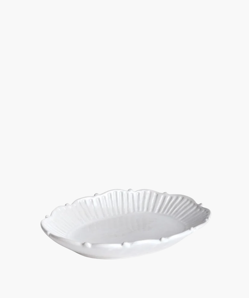 Small white ceramic catchall tray with a decorative rim. | SW Home