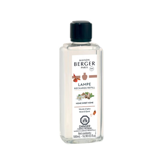 A 500ml Maison Berger fragrance diffuser refill bottle with a label showing various botanical illustrations and the scent names 'Home Sweet Home'.