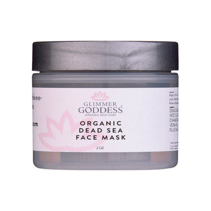 Glimmer Goddess Organic Dead Sea Face Mask in clear jar with black lid, featuring pink lotus design