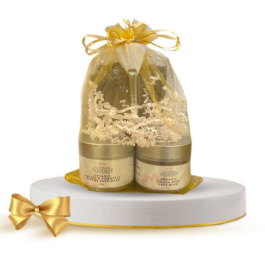 Organic face mask gift set with gold ribbon, featuring papaya pineapple and cocoa mint masks in elegant packaging