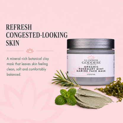 Glimmer Goddess Organic Rosemary Mint Marine Face Mask jar shown on a soft pink background with promotional text, a green rosemary sprig, mint leaves, and a scoop of the mask.