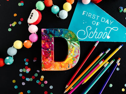 Oversized crayons in the shape of giant letters. This is a giant letter D that has rainbow colors in ROYGBIV order.  First day of school gift for kids or teacher gift idea.