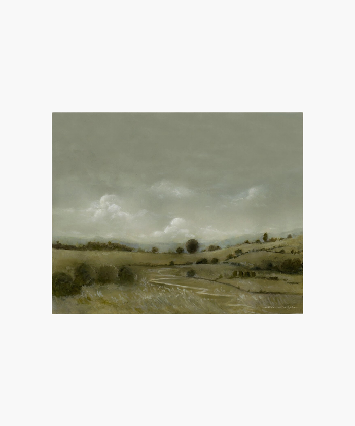 A serene landscape painting depicts rolling hills under a cloudy gray sky. The muted green and brown tones evoke a calm, tranquil atmosphere. | Wildwood Home Co.