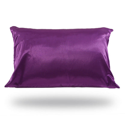 The Perfect Locks Satin-Silk Pillowcase in black, designed to protect hair extensions, floats above a soft shadow on a white background.