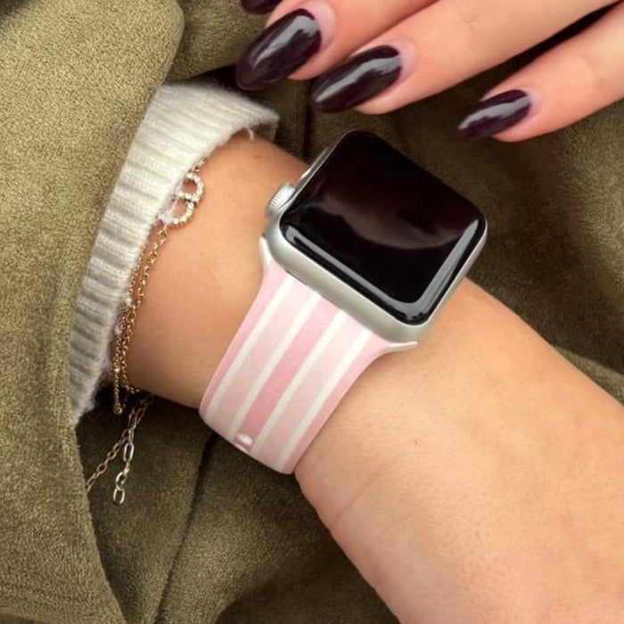 Coconut Lane Apple Watch strap with pink and white stripes pattern.