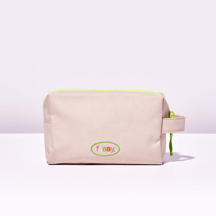 Fussy's Recycled Washbag in pale pink with a lime green zip and Fussy logo