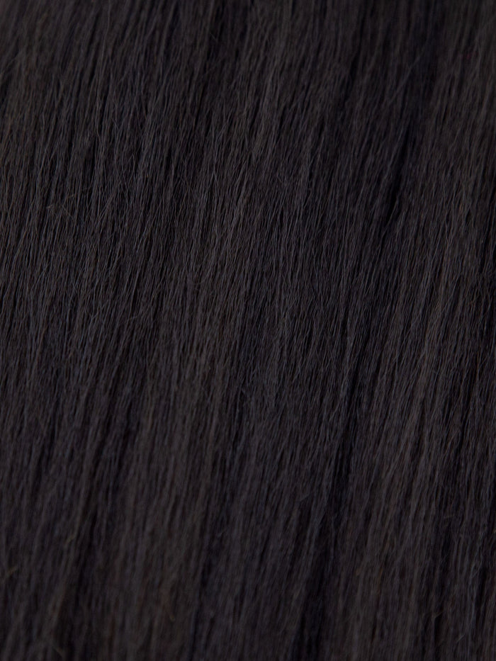 Close-up of smooth, dark brown or black hair strands, highlighting the texture and healthy, natural shine.