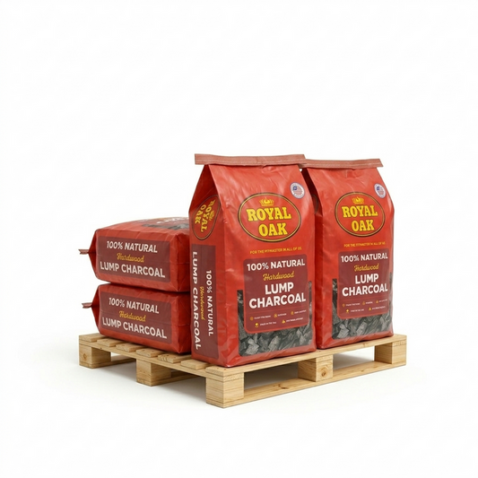 Three bags of Royal Oak lump charcoal on a wooden pallet with a white background