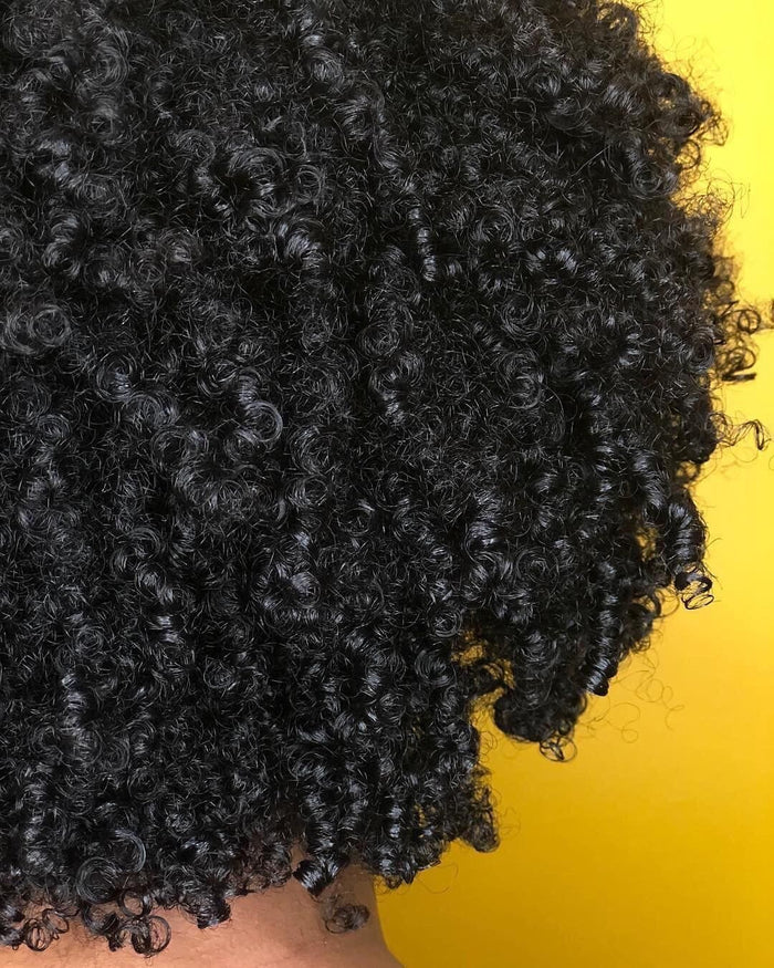 Butterbloom deep herbal hair and oil mask in an 8oz jar, featuring natural herbal ingredients for nourishing hair.