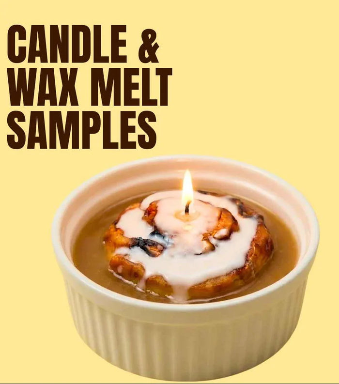 Dessert-inspired candle sample in a ramekin with icing design and prominent flame, labeled 'candle & wax melt samples'.