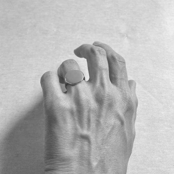 Species by the Thousands Sol signet ring in brass on hand.