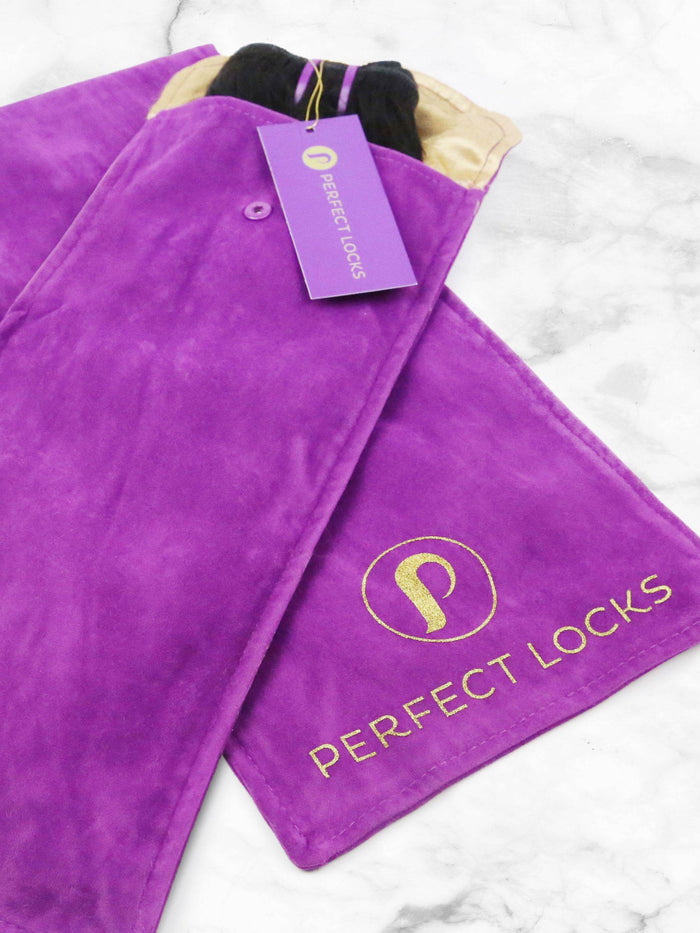 A purple suede pouch with the gold "Perfect Locks" logo holds a Straight Swiss Lace Closure; matching tag on marble surface.