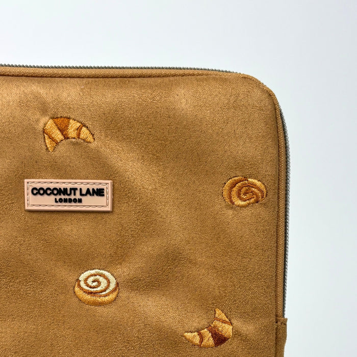 Brown suede iPad sleeve with croissant embroidery and a French-inspired design by Coconut Lane.