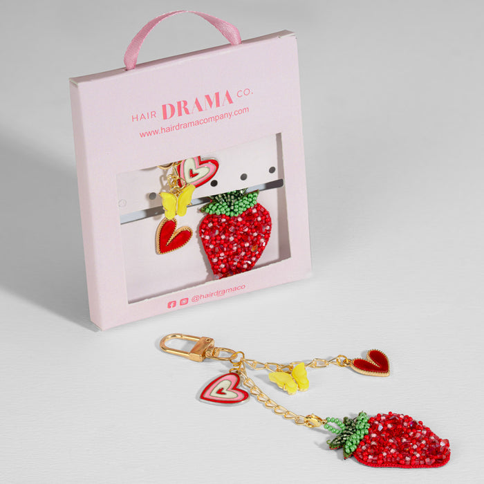 Sweetberry Squad bag charm with embroidered strawberry, hearts and butterfly on a gold chain