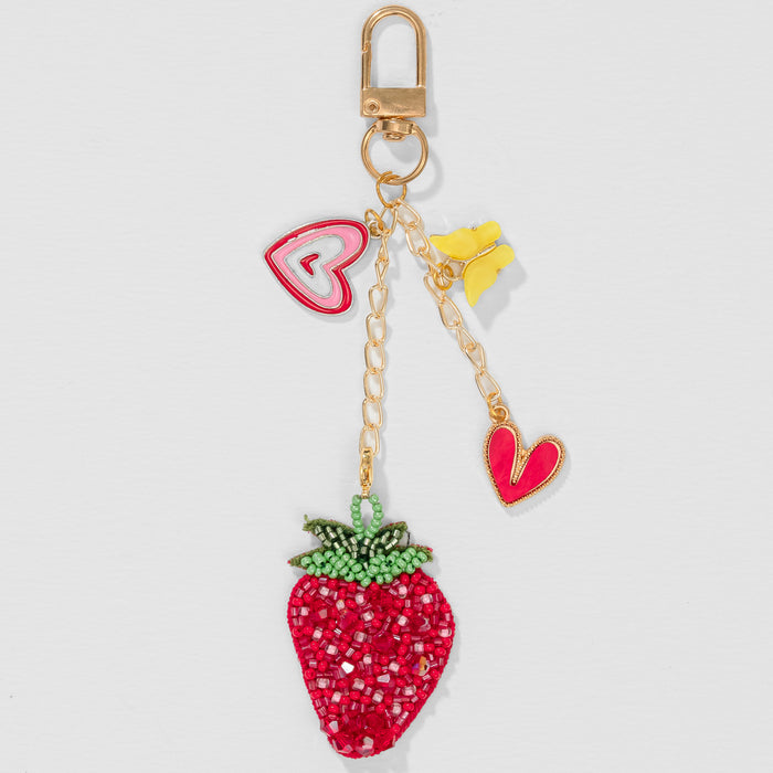 Hand-embroidered strawberry charm with heart accents and butterfly for bags or keys