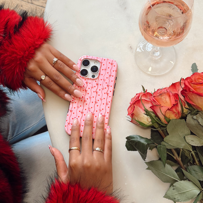 Love Tied Phone Case on table