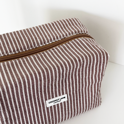 Coconut Lane towel makeup bag with chestnut brown and white stripes, soft textured fabric, zip closure.