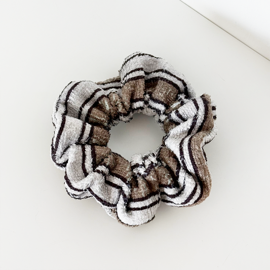 Coconut Lane towel scrunchie with retro brown, black, and white stripes on a white background.