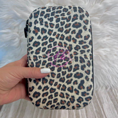 Travel Size Leopard Print Fancy Band Storage Case — Case made of PU leather, Nylon, Multi spandex, Lycra Dimensions are W 8 1/2" x L 5 1/2" x H 2 1/4" This item is storage case only bands not inclu...