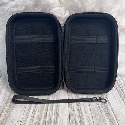 Travel Size Leopard Print Fancy Band Storage Case — Case made of PU leather, Nylon, Multi spandex, Lycra Dimensions are W 8 1/2" x L 5 1/2" x H 2 1/4" This item is storage case only bands not inclu...